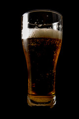 Glass of beer on a black background