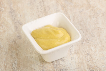 Organic mustard sauce in the bowl