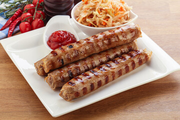 Grilled sausages with cabbage and sauce