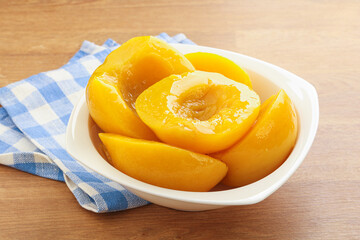 Sweet canned peaches with syrope
