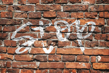 Texture of a brick wall with an inscription
