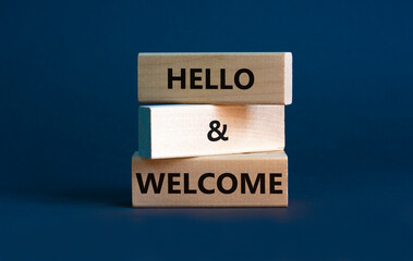 Hello and welcome symbol. Concept words Hello and welcome on wooden blocks. Beautiful grey...