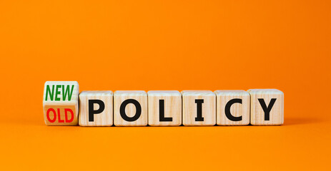 New or old policy symbol. Turned wooden cubes changed concept words Old policy to New policy. Beautiful orange table orange background. Business old or new policy concept. Copy space.