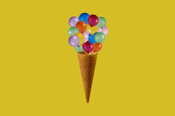 Ice cream cone and colorful balloons.