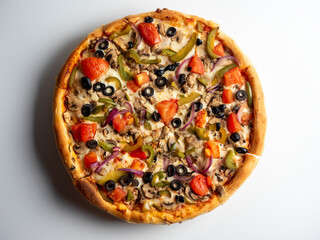 Close-up of a delicious vegetarian pizza with vegetables and mushrooms on a white background. Top view, flat lay Junk food.