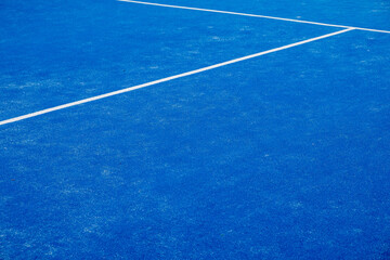 blue artificial grass paddle tennis court, racket sports concept