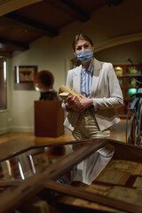 women in the museum looks at art exhibitions.