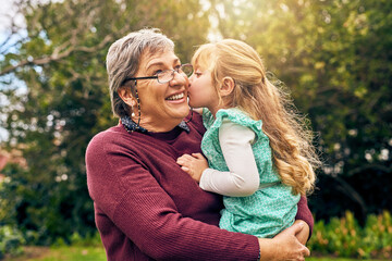 You will always be Grannys little girl. Shot of a granddaughter kissing her grandmother on the...