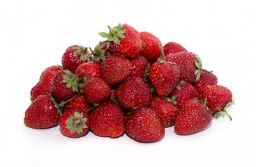 Strawberries on a white background. Strawberry close-up isolated. Juicy berries picked for dessert.