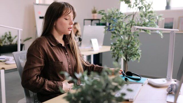 Sick unhealthy young woman clasping belly and suffering from severe abdominal pain, periods spasm, irritable bowel syndrome of diet. High quality 4k footage