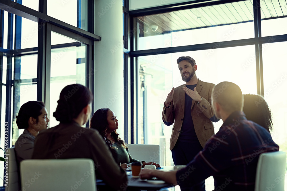 Poster anything is possible if we work together as one. shot of a businessman giving a presentation in the 