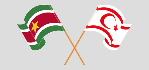 Crossed and waving flags of Suriname and Northern Cyprus