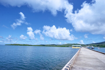Obraz premium Concrete pier on the sea shore.