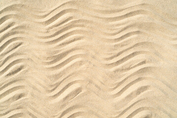 Texture of sea sand background closeup with ornament