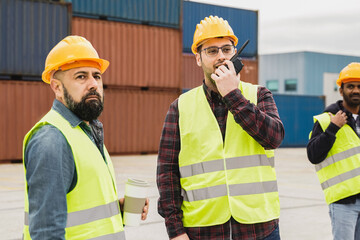 Engineer industrial people working at shipping containers port terminal - Freight logistics...
