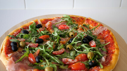 Italian pizza on a wooden plate