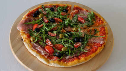 Italian pizza on a wooden plate