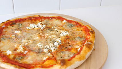 Italian pizza on a wooden plate
