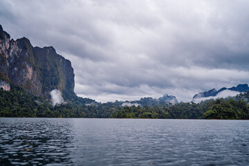 Fototapeta premium Beautiful landscape with lake, mountains and natural attractions on Cheow Lan Lake at Khao Sok National Park, Surat Thani Province, Thailand.
