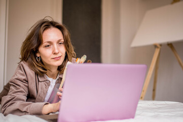 Painting Student Woman with Holding Brushes Ready to Attend Online Lessons and Paint White Canvas...