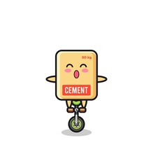 The cute cement sack character is riding a circus bike