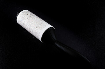 Close-up of a used fabric roller at an angle