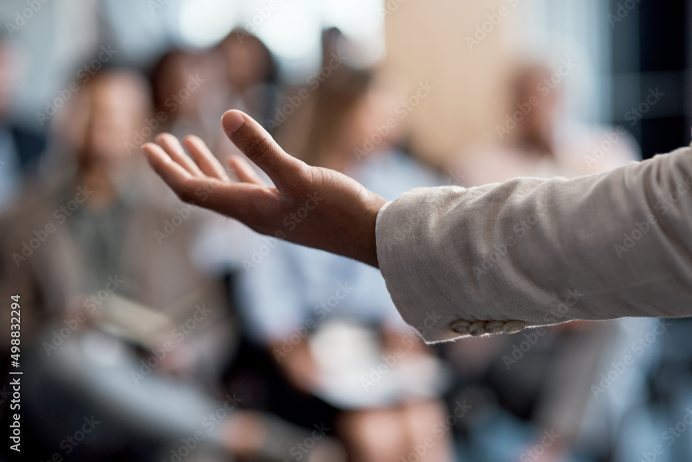 Poster any questions. shot of an unrecognizable businessman delivering a presentation at a conference.