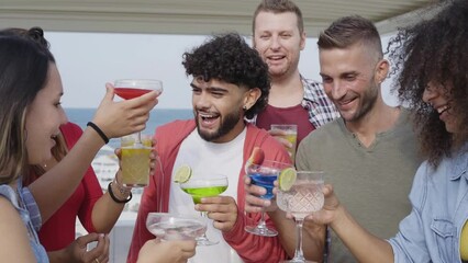 Slow motion. Multiracial Young people Friends cheers having fun together toasting cocktails at rooftop. Social community life style concept