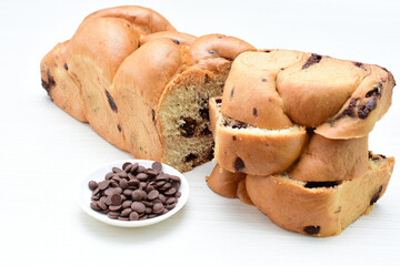 Artisanal bread with a touch of chocolate, displayed on white wood