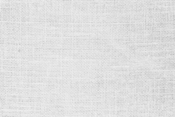 Fototapeta na wymiar White fabric jute hessian sackcloth canvas woven gauze texture pattern in light white color blank decoration. 