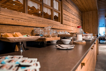 Nutritional food arranged on counter against window at luxurious dining room