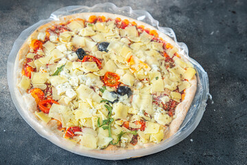 frozen pizza food packaging cling film cellophane quick defrost fresh healthy meal food snack diet on the table copy space food background rustic top view
