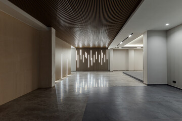 Spacious modern entrance interior in a multi-storey residential building in the city center.