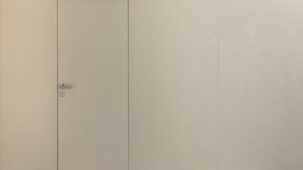 White door hidden mounting in the wall.