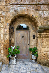 Fototapeta na wymiar A well blended door in a medieval stone building