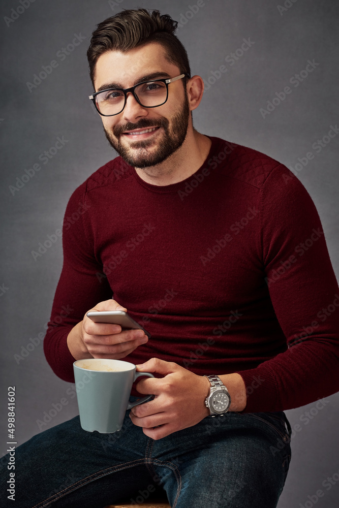 Poster i like strong coffee just as i like strong wifi. studio portrait of a handsome young man texting on 