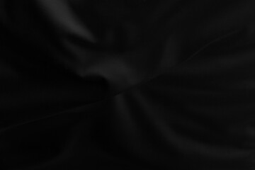 Black fabric texture for background; Abstract black fabric cloth wave or wavy folds texture material for background