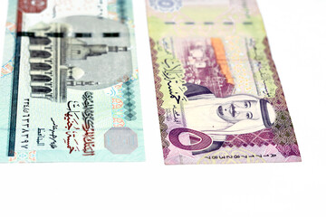 The obverse sides of Saudi Arabia 5 five riyals banknote with 5 LE five Egyptian pounds bill...