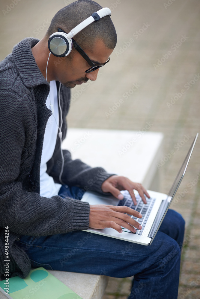 Aufkleber Technology is changing and improving the way we learn. Cropped shot of a college student using his laptop while sitting outside at campus.