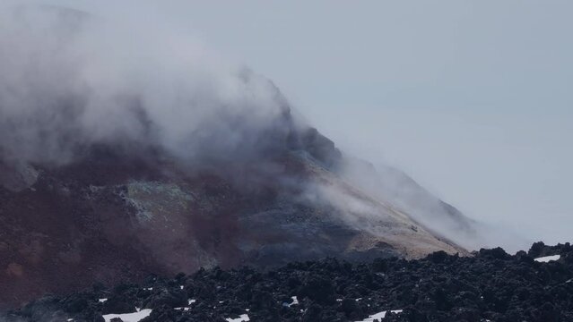 Caldera of Avachinsky stratovolcano, also known as Avacha Volcano. Swinging steam from hot geysers. Kamchatka Peninsula, Russia.