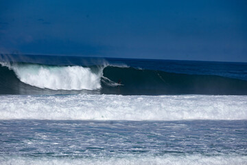 wave crashing on rocks