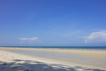 Fototapeta na wymiar sand dunes and sea with space on the blue sky