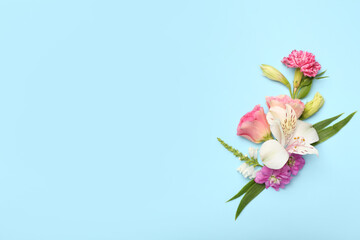 Composition with delicate flowers on blue background