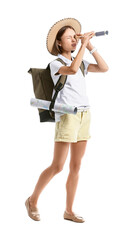 Female tourist with map and spyglass on white background