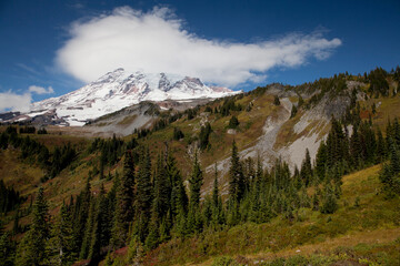 An unusual cloud partially covers Mt. Rainier at Mt. Rainier National Park in Washington state
