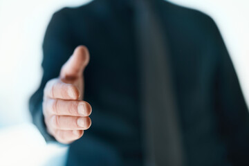 Giving you a warm welcome. Cropped shot of an unrecognizable businessman reaching out for a handshake.