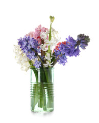 Vase with gorgeous hyacinth flowers on white background
