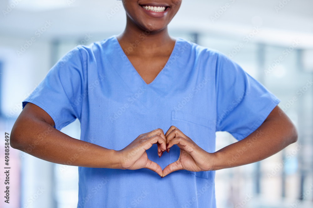 Poster ive got the caring touch. shot of an unrecognizable doctor making a heart shape with their hands at 