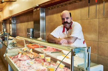 For a variety of meats, come to my butcher. Shot of a butcher at his store.