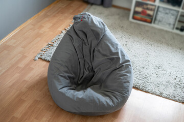 grey bag chair or bean armchair at home in living room
